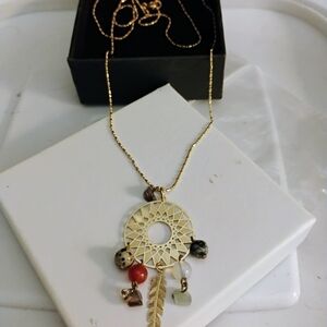 Elegant Gold Tone Pendant Necklace with Charms
